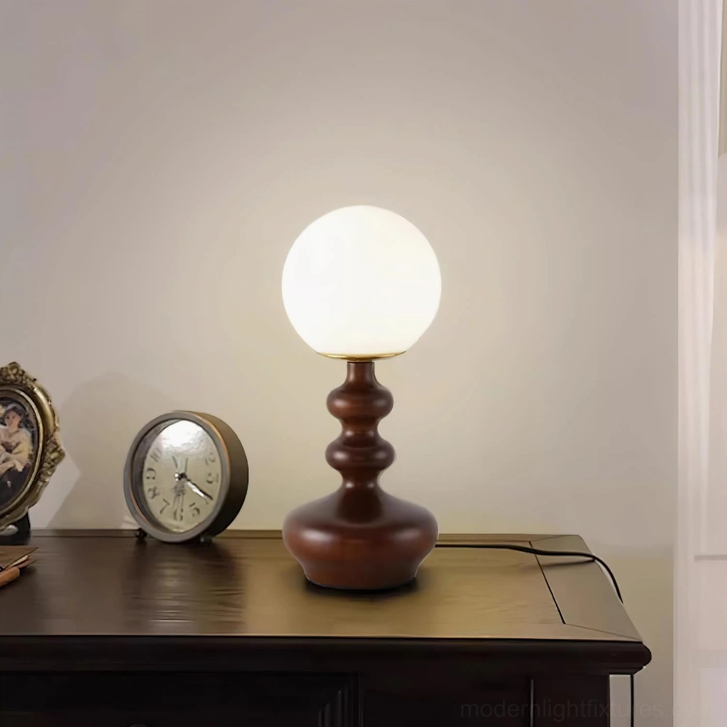 Gleason frosted globe table lamp showcasing sculptural wooden base and minimalist design aesthetic