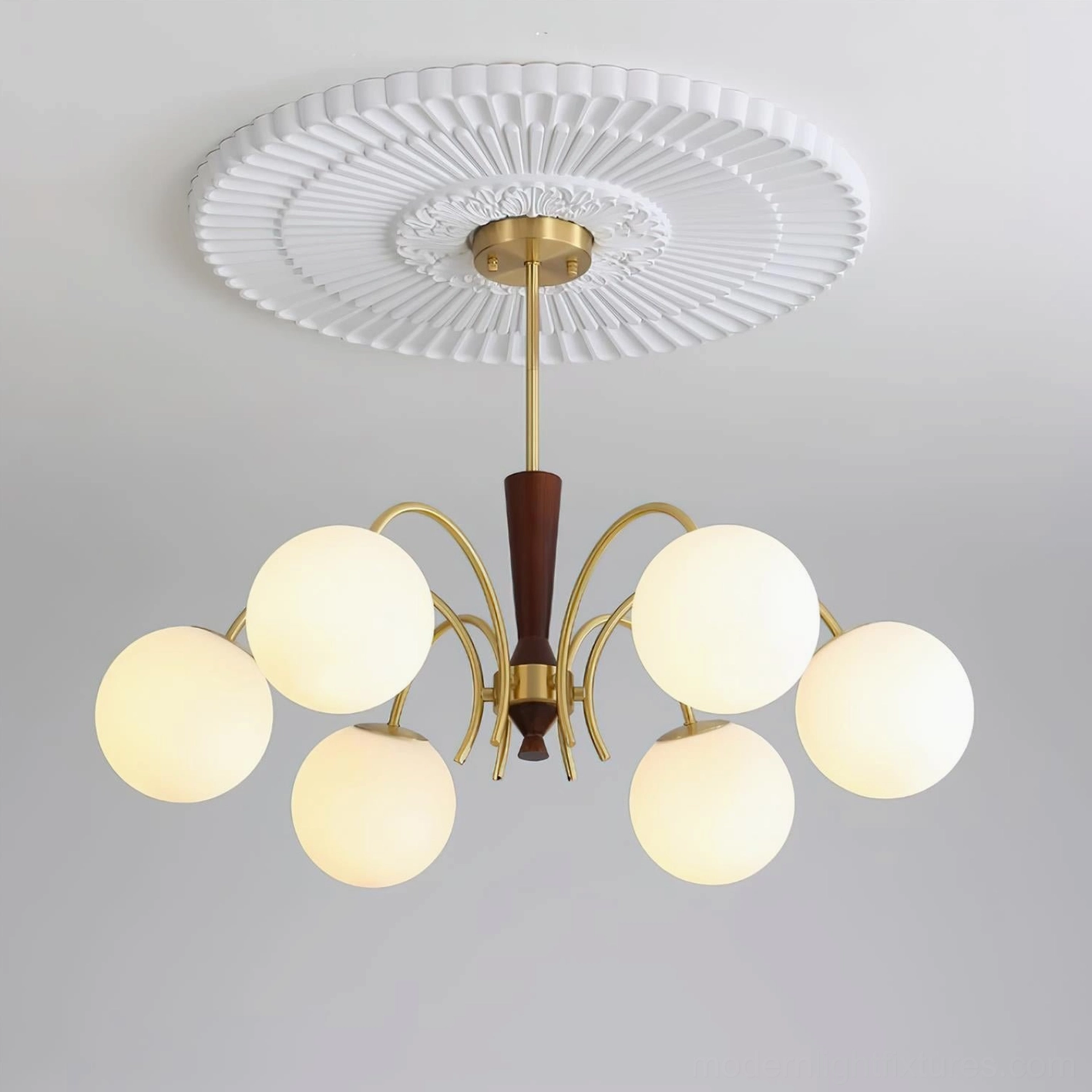 Contemporary globe chandelier installation demonstrating warm light diffusion through frosted milk glass