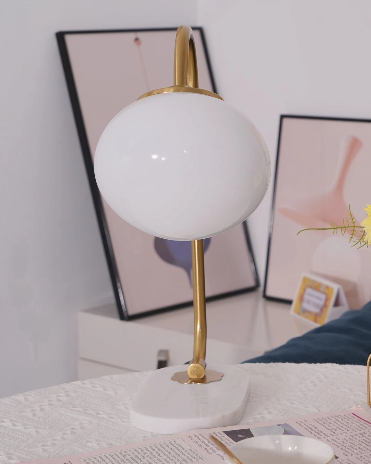 Interior placement of globe table lamp in bedroom nightstand setting with warm ambiance
