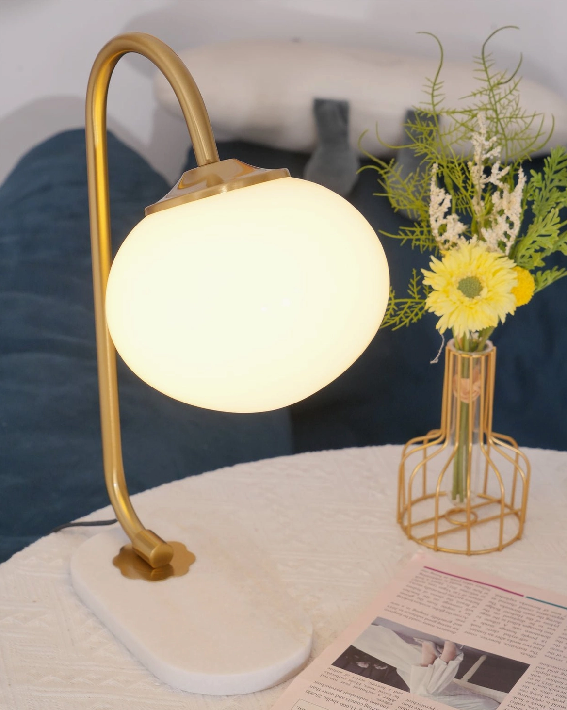 Home office globe table lamp providing ambient lighting at workspace desk furniture