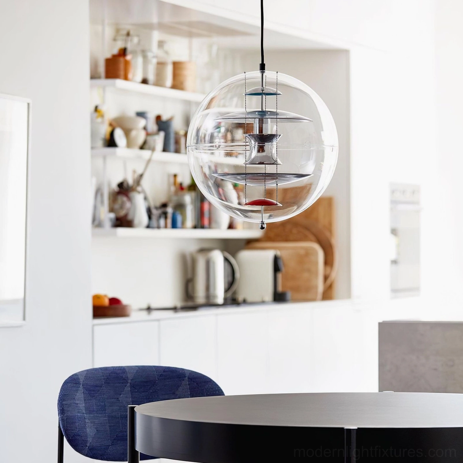 Modern globe pendant light with clear acrylic sphere and visible interior metal structure
