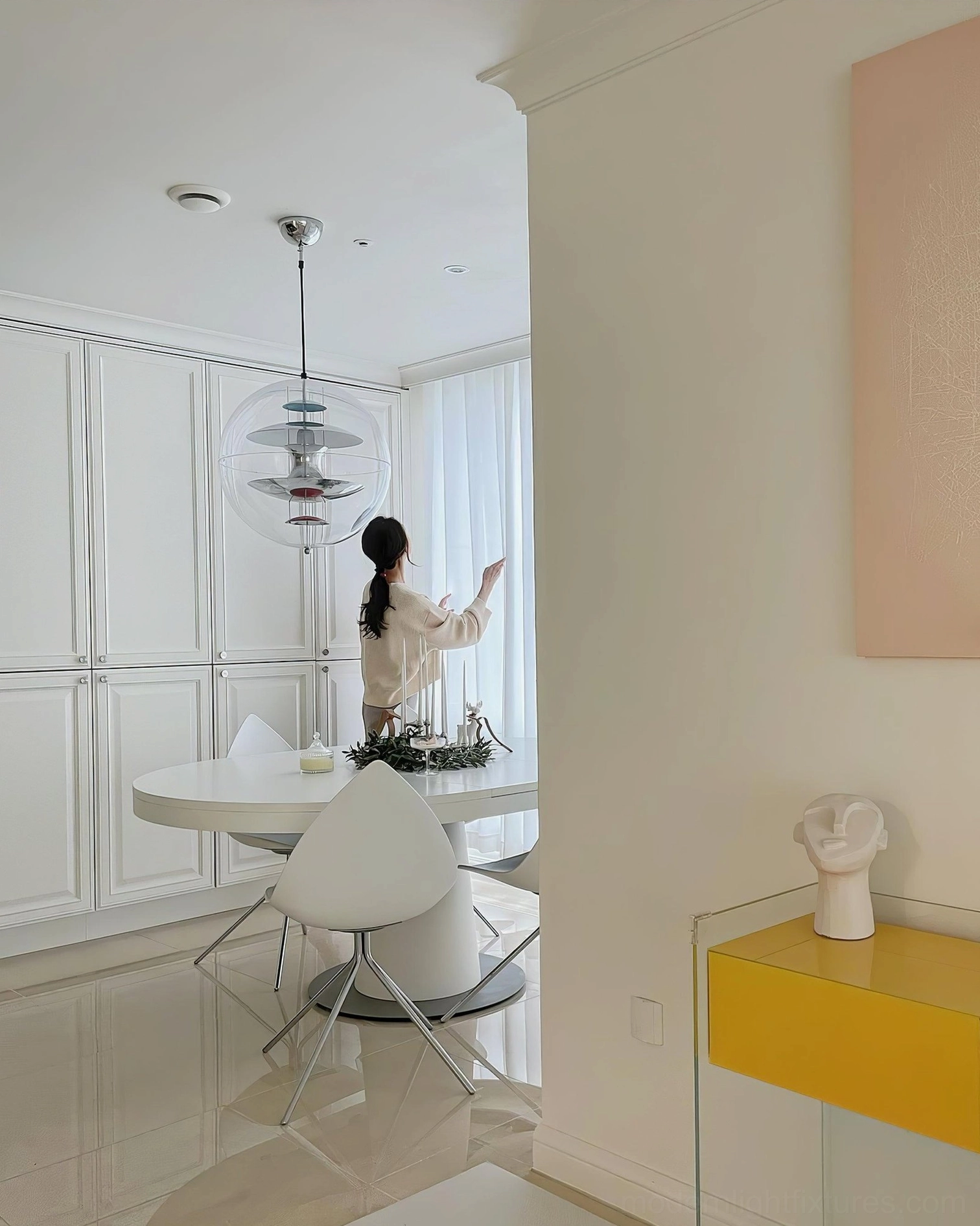 Contemporary pendant fixture featuring geometric sphere shape and aluminum hardware