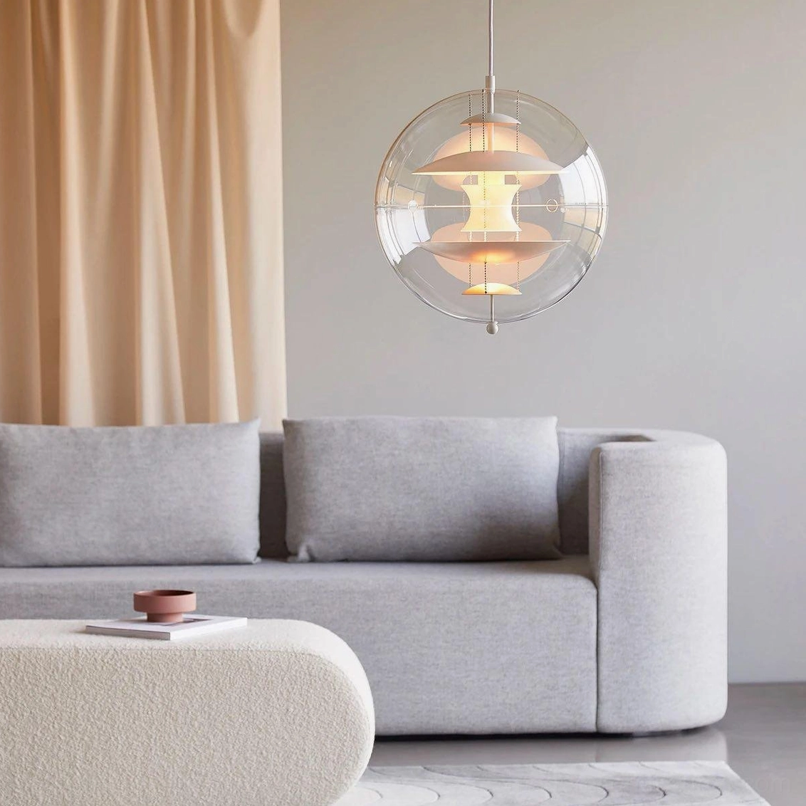 Modern pendant light with sphere design in industrial contemporary interior space