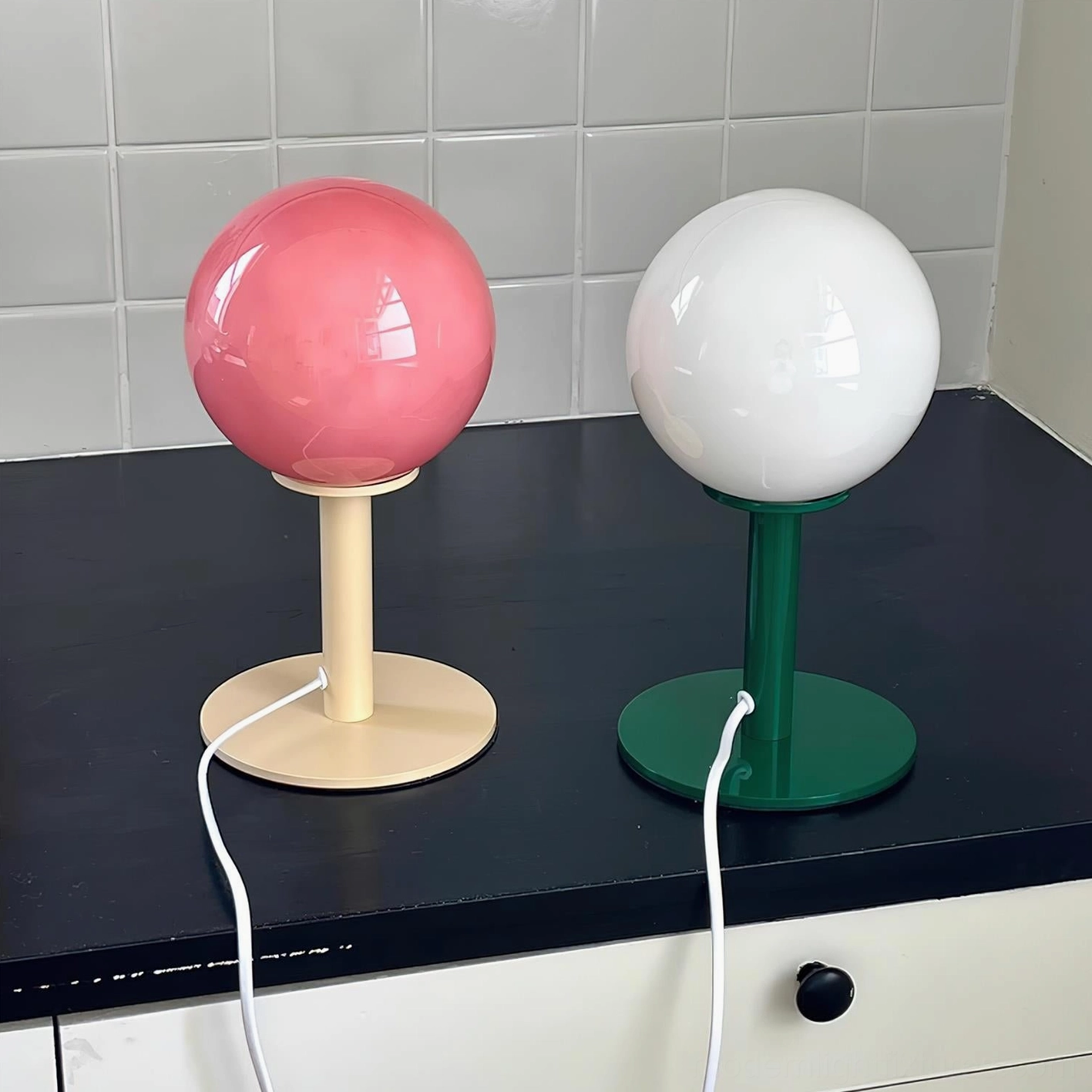 Multiple globe table lamps paired for balanced restaurant-quality dining table illumination