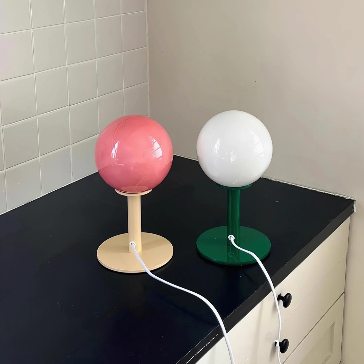 Eclectic interior design globe table lamp layered styling with botanical and natural elements