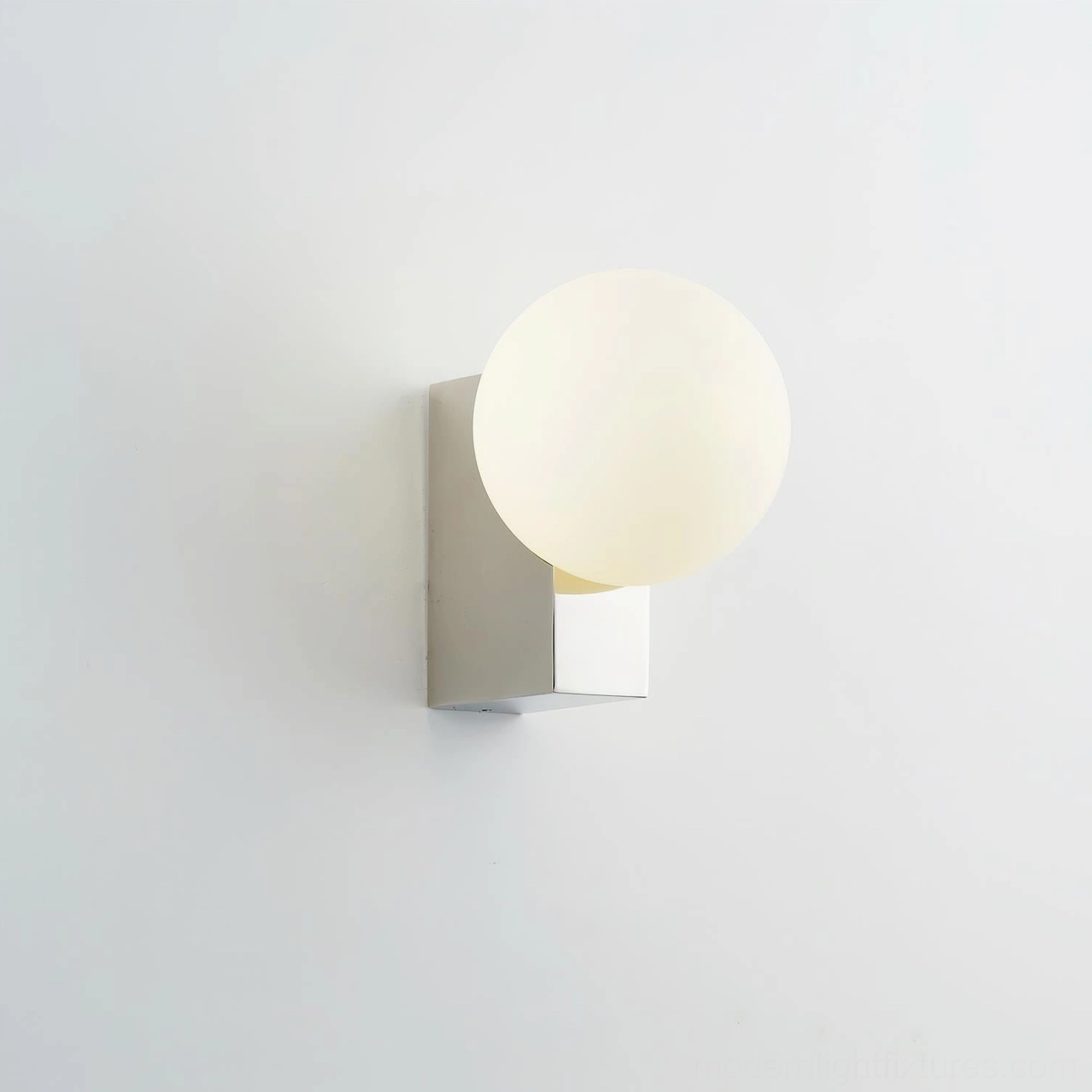 Glowen globe wall lamp mounted on bedroom wall, frosted glass sphere with minimalist design in neutral interior