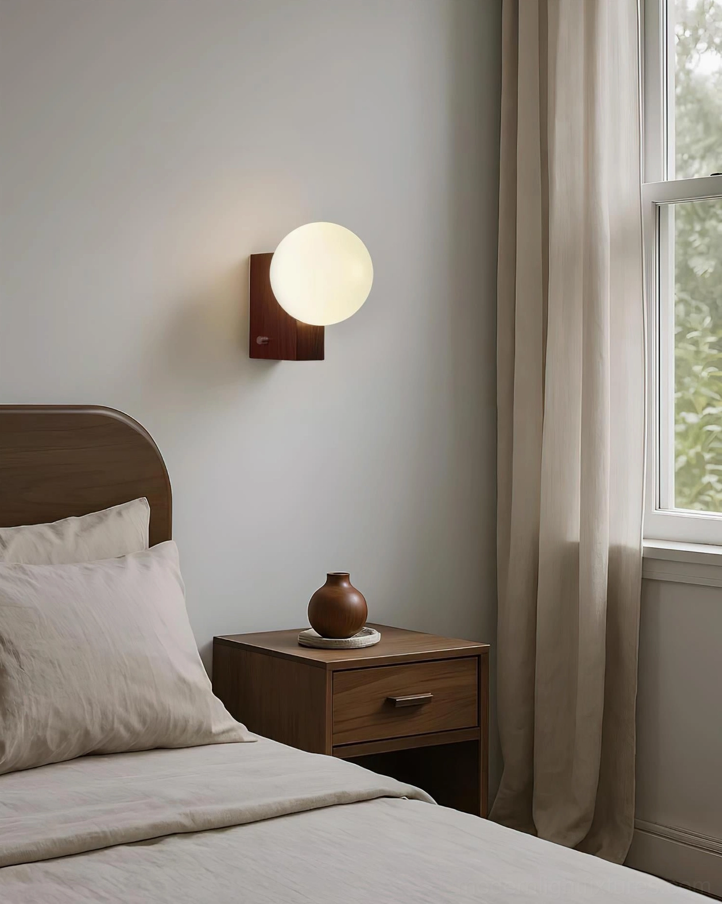 Glowen globe wall sconce in warm bedroom setting with nightstand and window, walnut wood base minimalist aesthetic