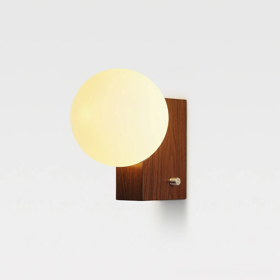 Walnut and white globe wall lamp with metal switch knob, soft studio lighting showing minimalist design details