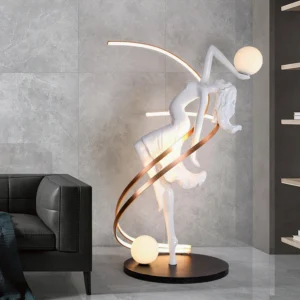 Goddess sculpture floor lamp in contemporary living room with grey tile walls and black leather sofa, warm ambient lighting