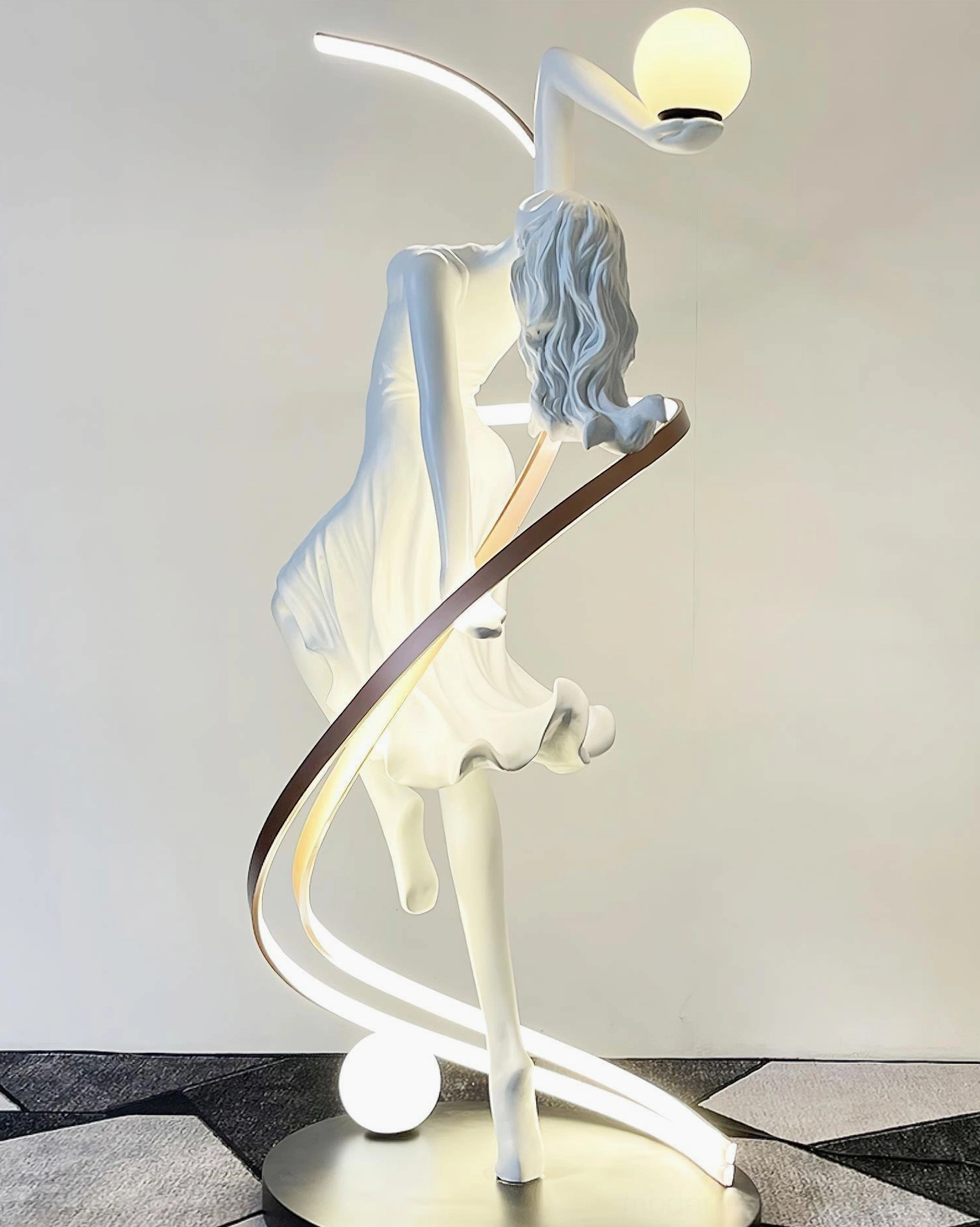 Goddess floor lamp lower glass orb light positioned at feet showing balanced dual illumination design