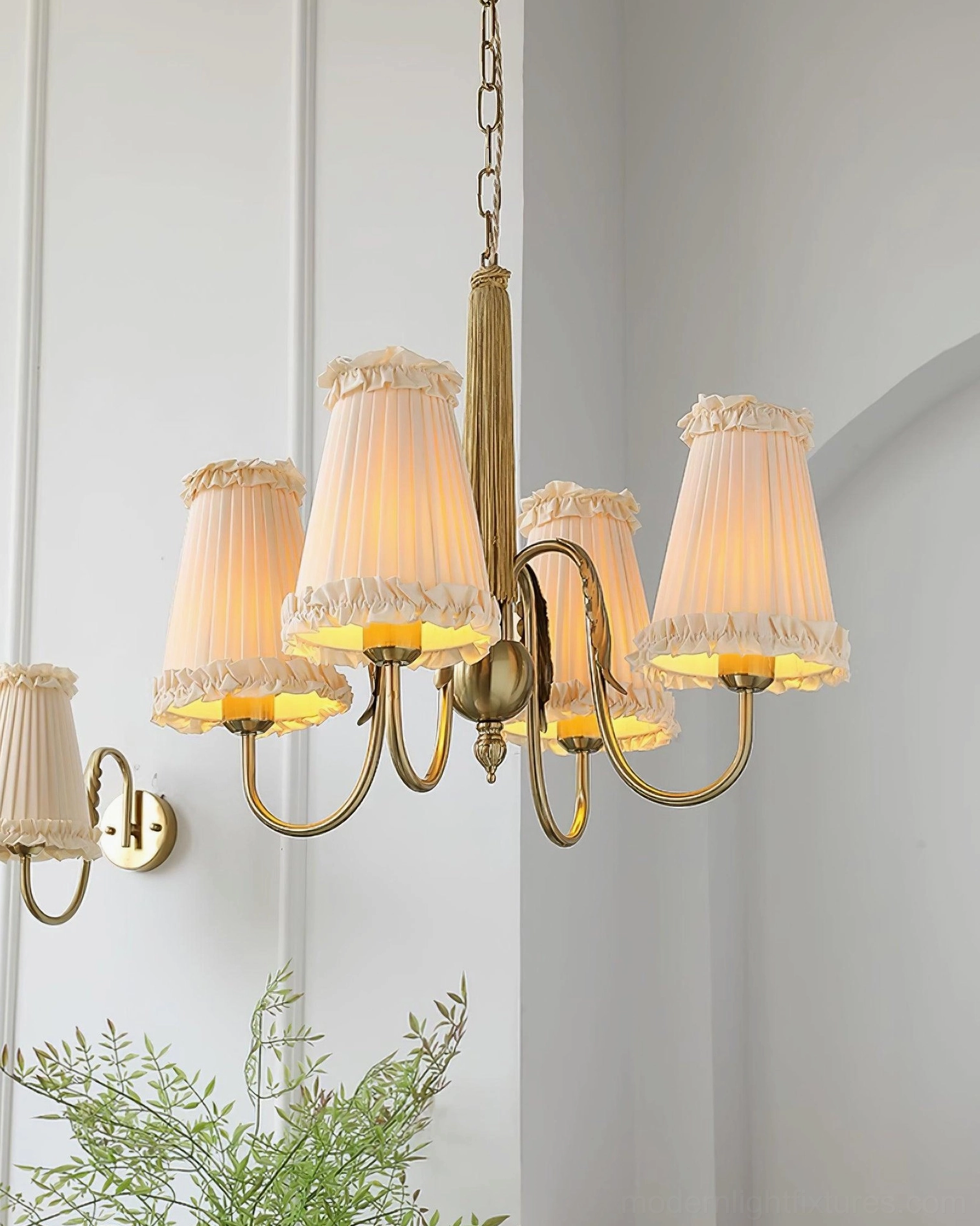 6-head gold chandelier with matching wall sconce minimalist white room