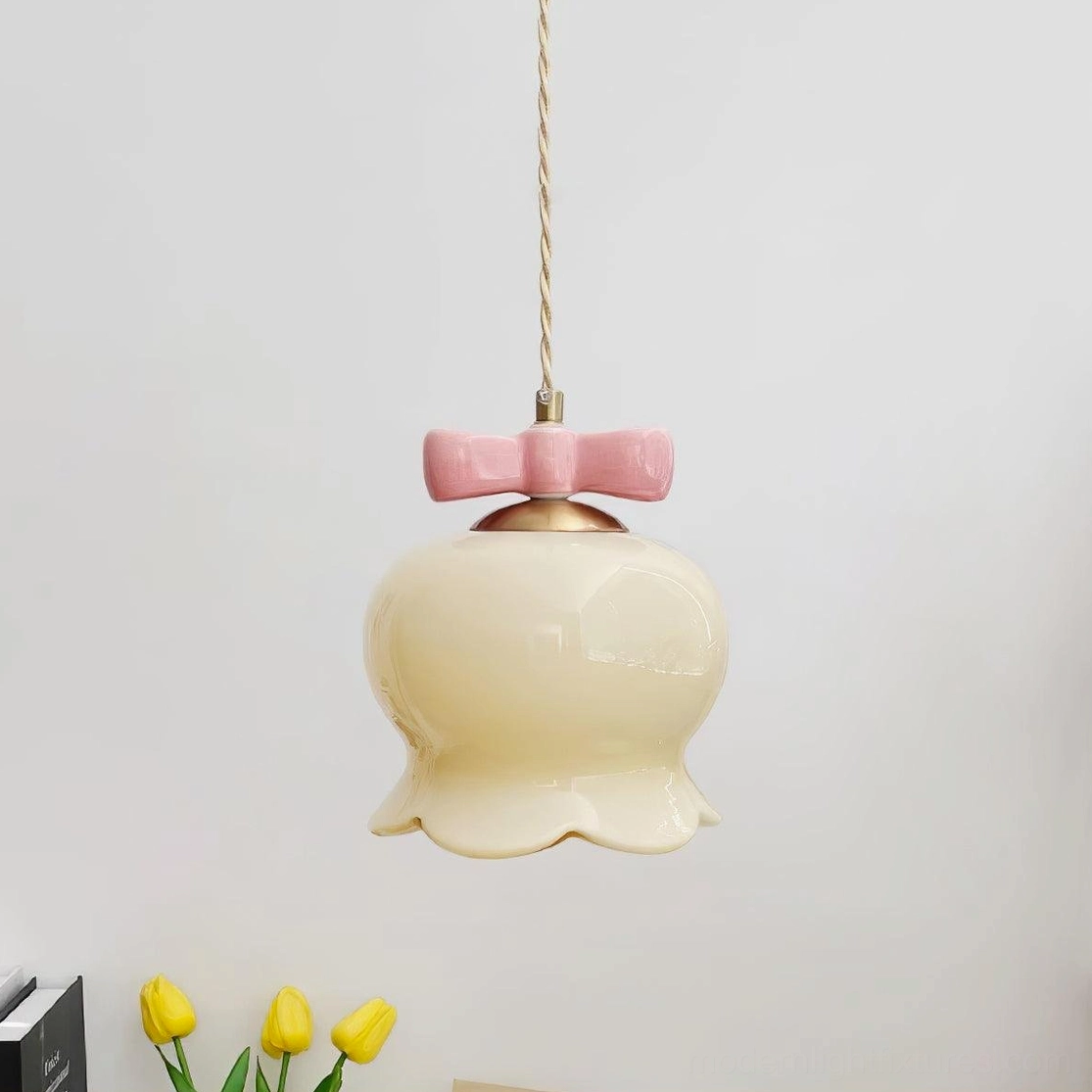Gold and beige bellflower ceramic pendant light with bow ornament color variation