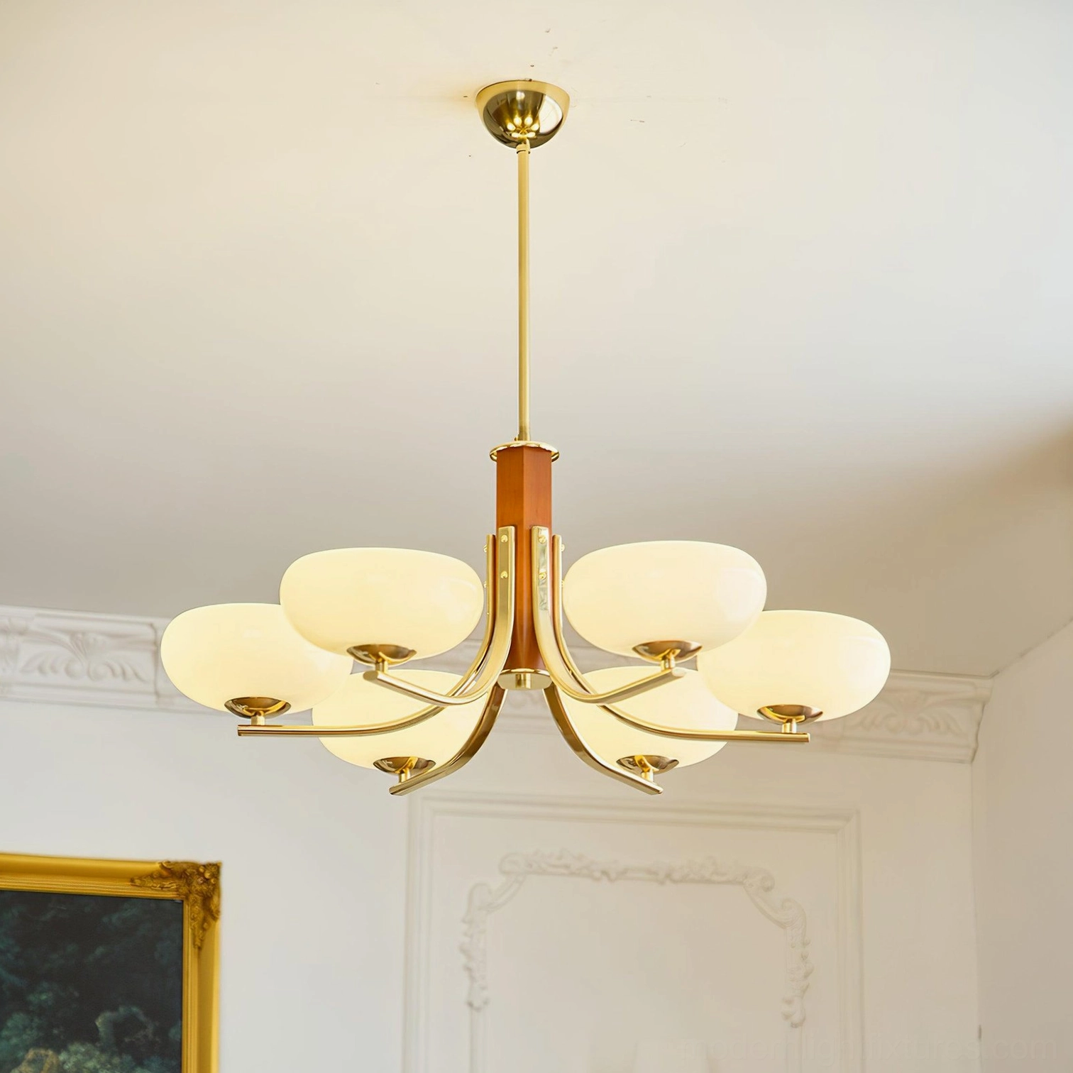 Gold and beige Larenta Rico 6-head chandelier with brass metalwork and natural wood stem in warm lighting configuration