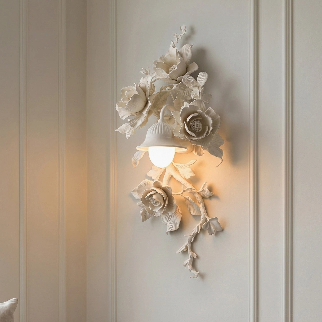 Gold Elysia Bloom rose wall sconce mounted above console table in elegant entryway, botanical lighting statement piece