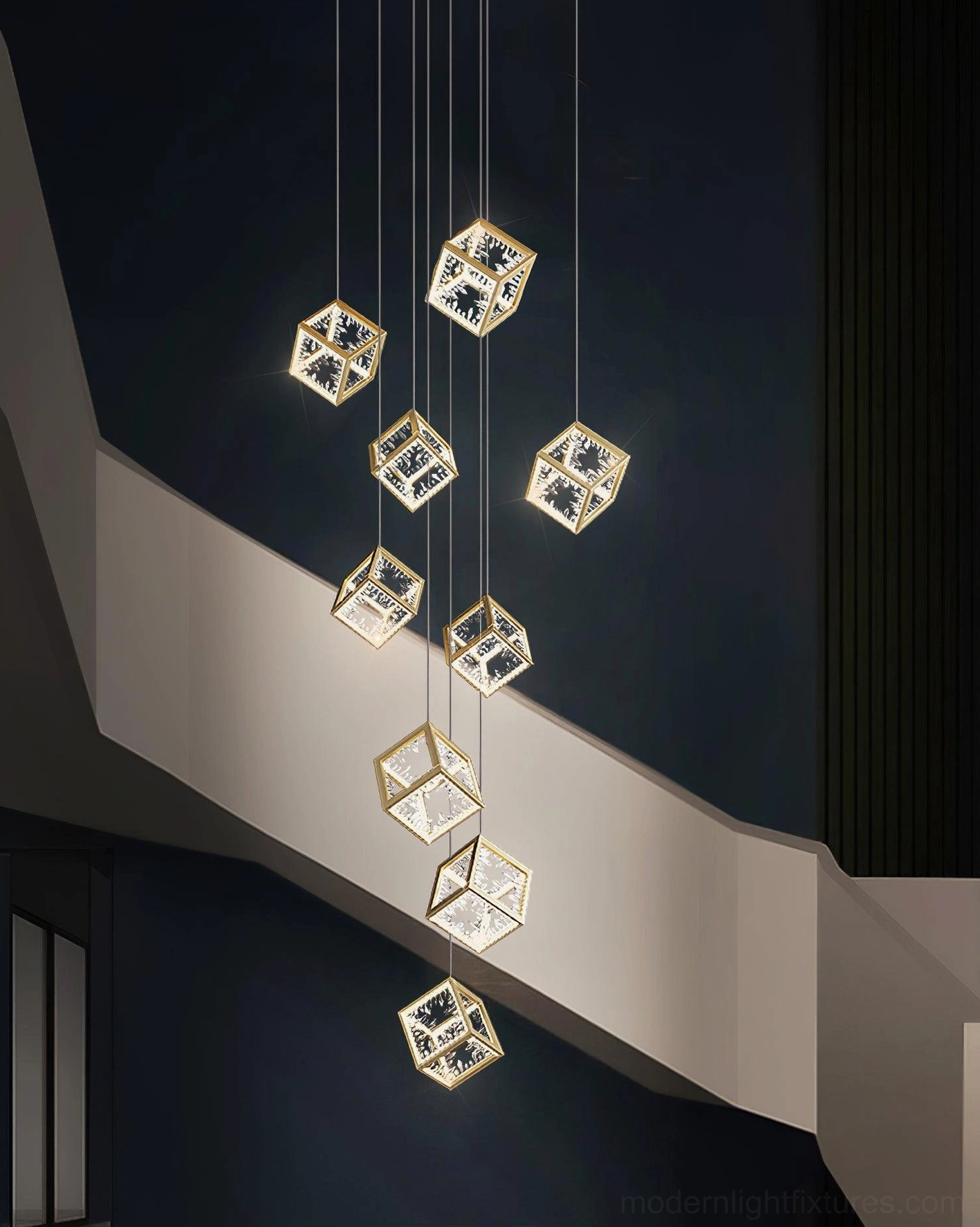Close-up detail of gold cubic chandelier crystal shade and geometric light refraction pattern