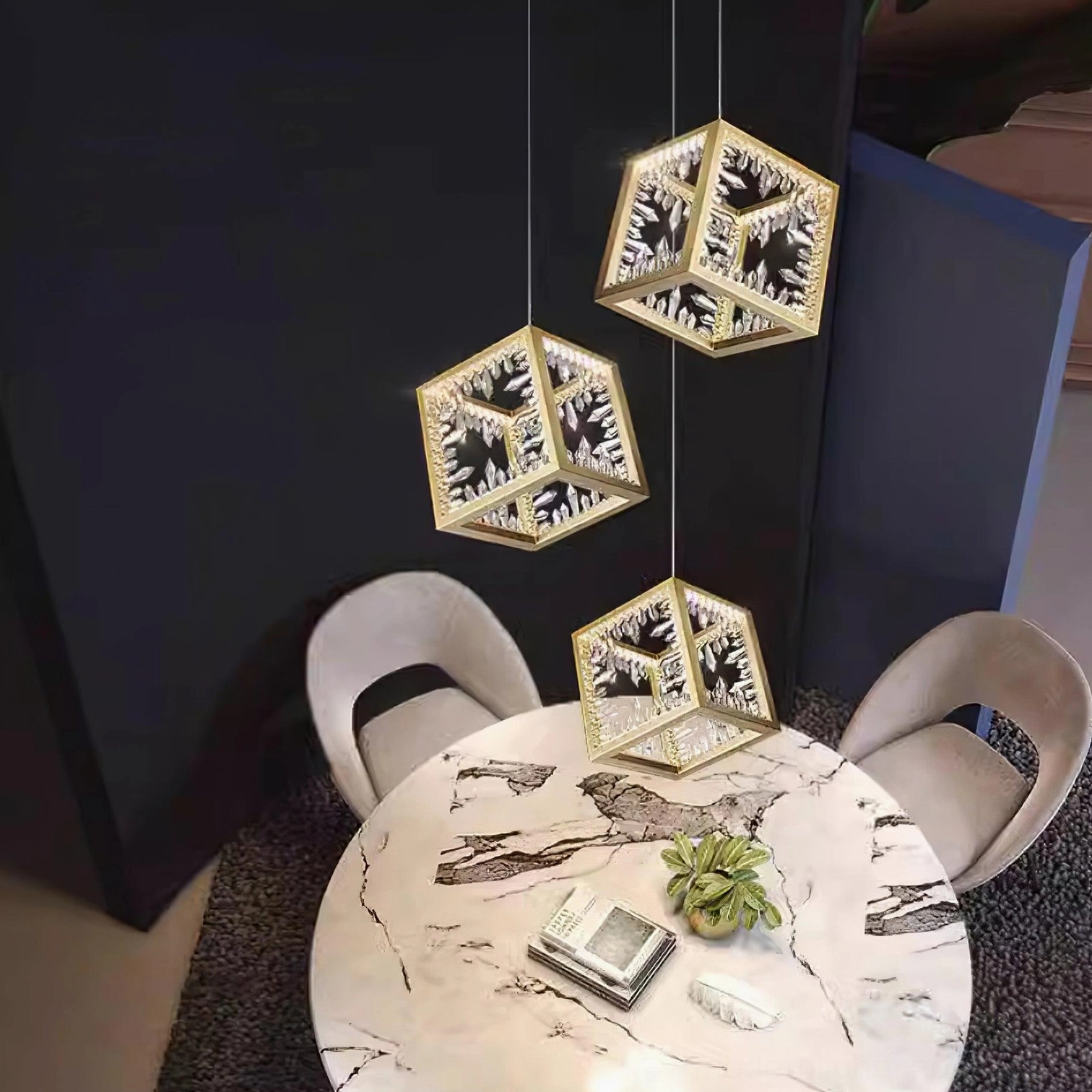 Gold cubic crystal chandelier above luxury dining table demonstrating sophisticated lighting ambiance