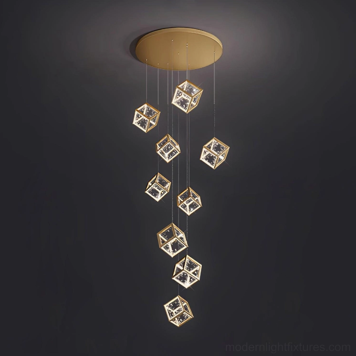 Minimalist gold cubic pendant light fixture against dark studio backdrop highlighting geometric design