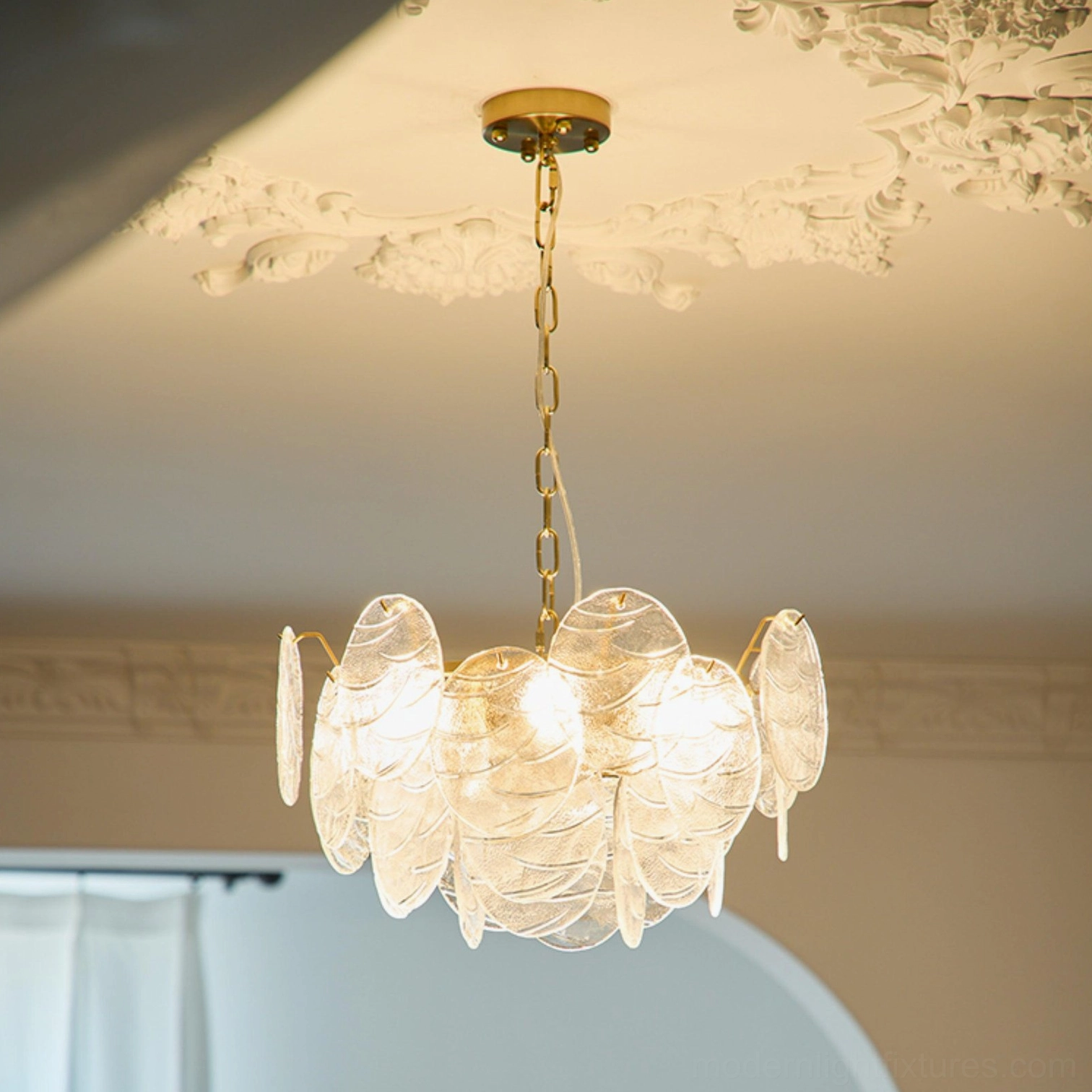 Gold disc Victorian chandelier textured clear glass creating dynamic light refraction