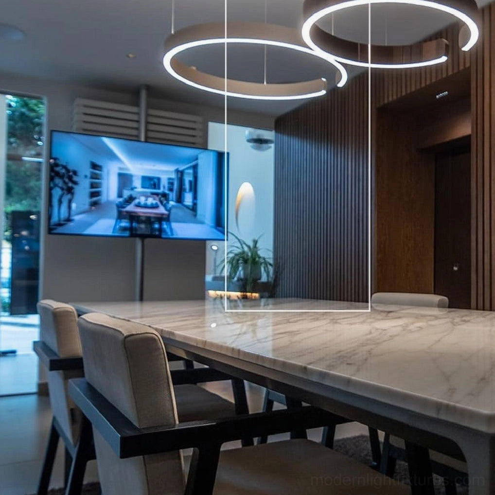 Gold finish halo ring pendant light installed in modern Scandinavian interior design space