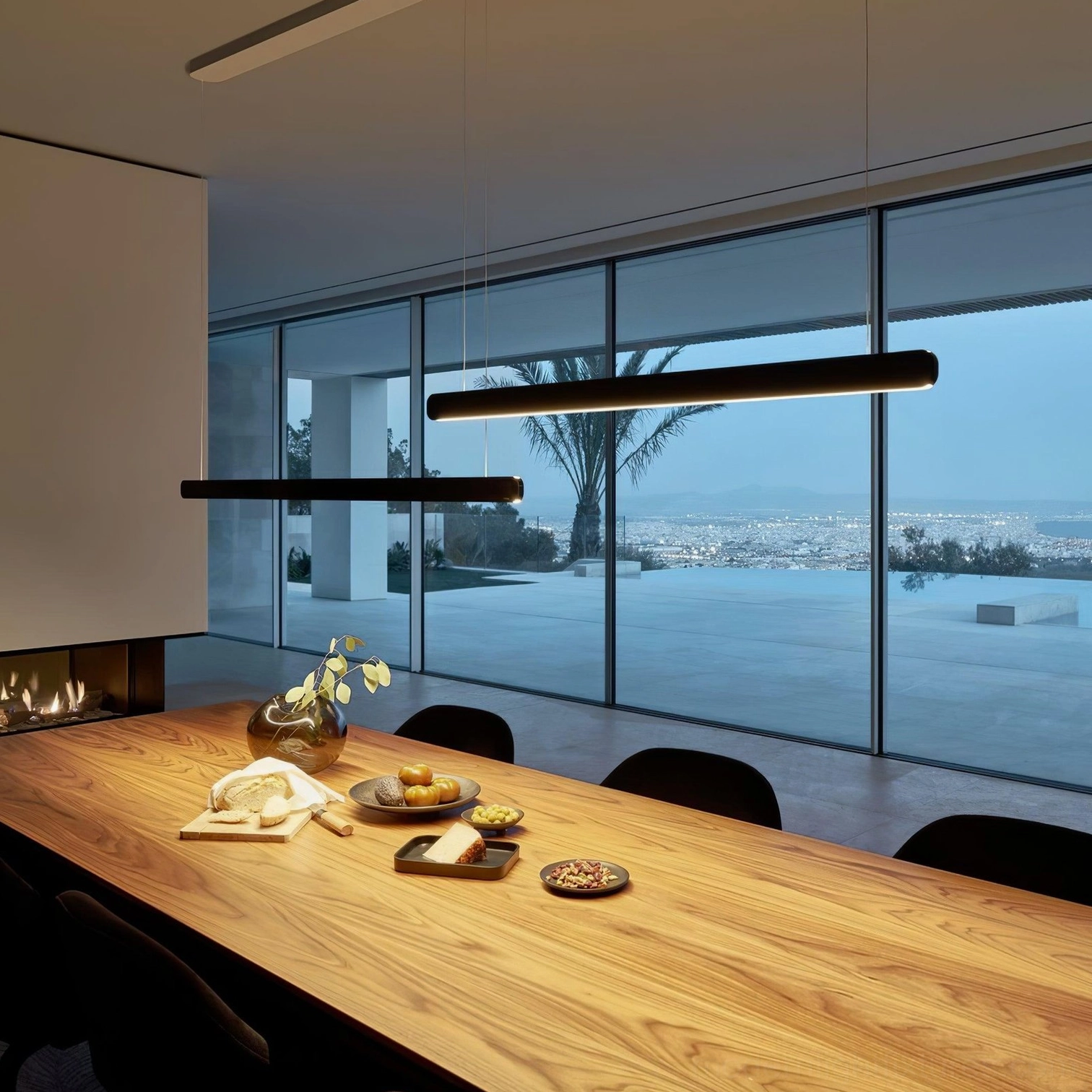Gold tone linear pendant light fixture in minimalist Scandinavian-inspired interior