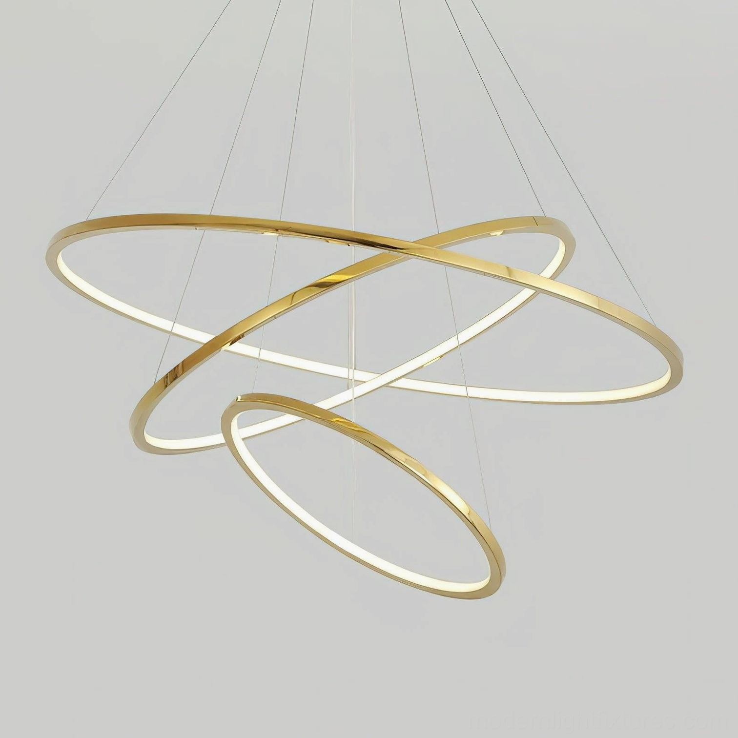 Detail view of intertwined gold ring chandelier showing LED integration and premium metal finish