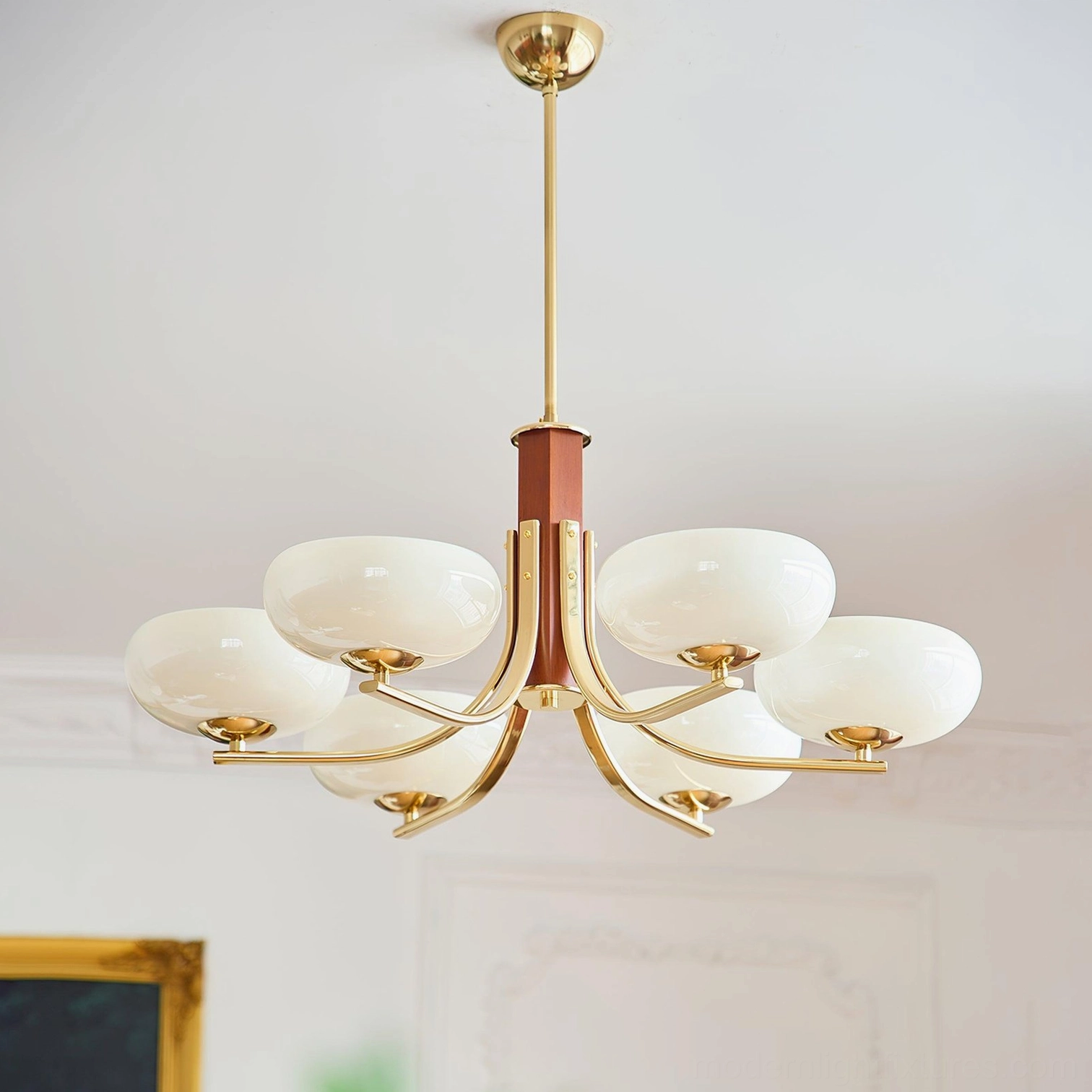 Gold and white Larenta Rico 6-head chandelier with warm brass finish, wood stem, and white opal glass