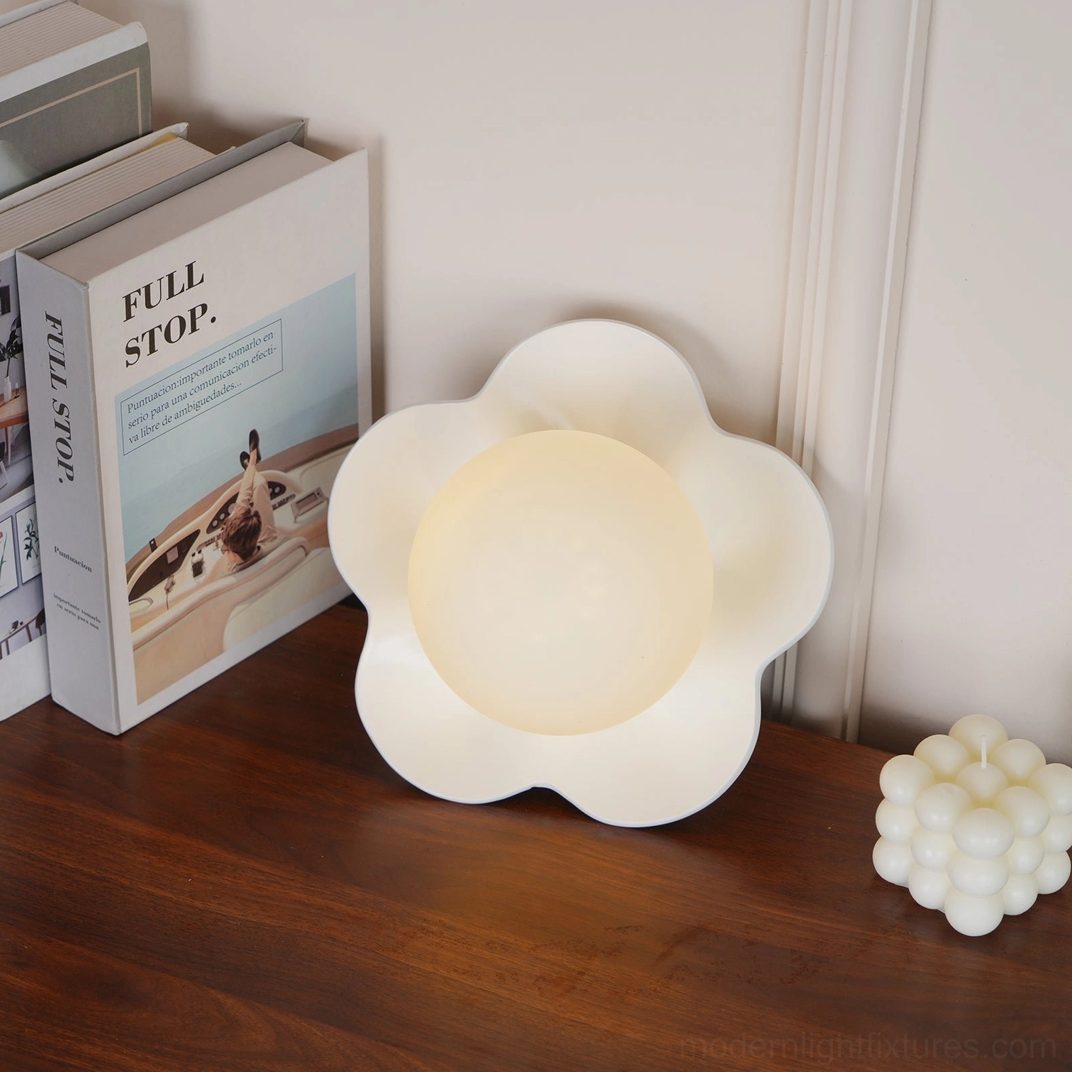 Golden yellow Fleur wall lamp above console - modern wall sconce adds personality and soft illumination to entryway