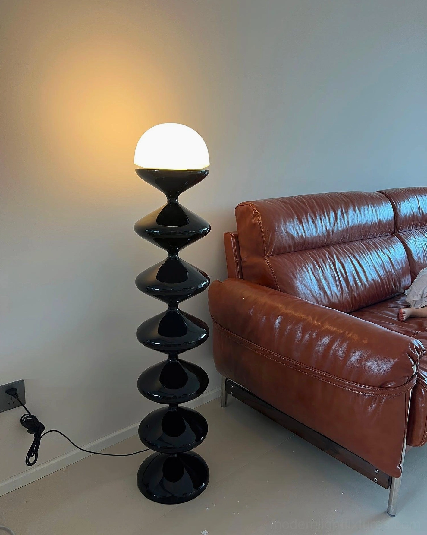 Sculptural gourd floor lamp showcasing organic curved silhouette and design detail