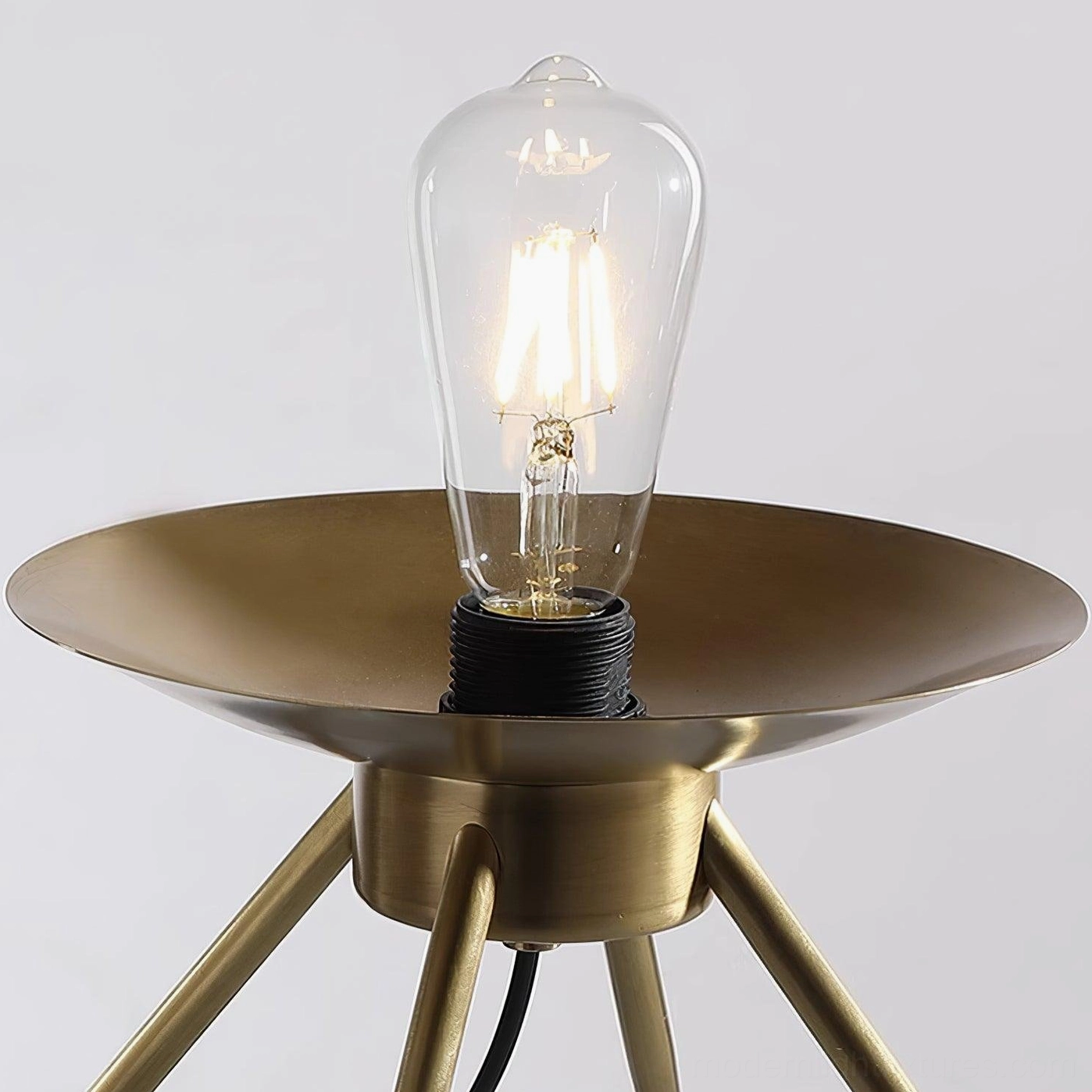 Gradient blue tiered glass table lamp base showing brass metal weight and stability feature