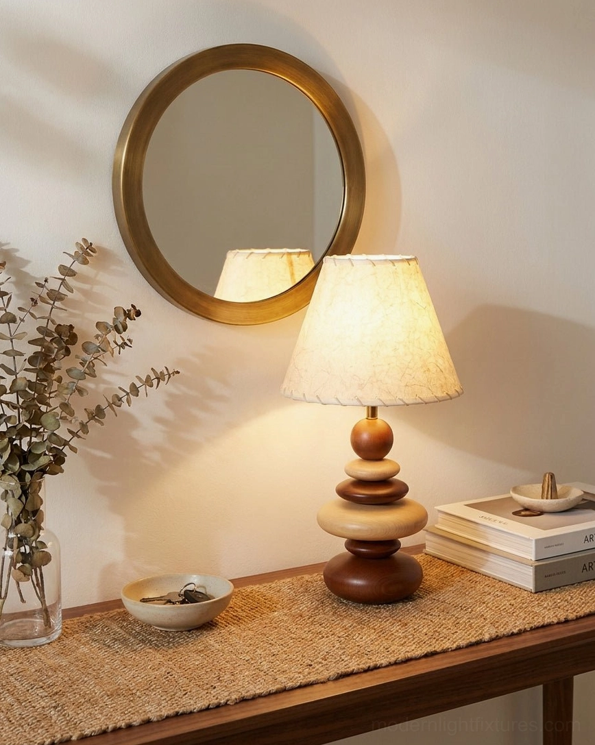 Grainelle table lamp on entryway console with round gold wall mirror, dried flowers, and woven natural fiber mat