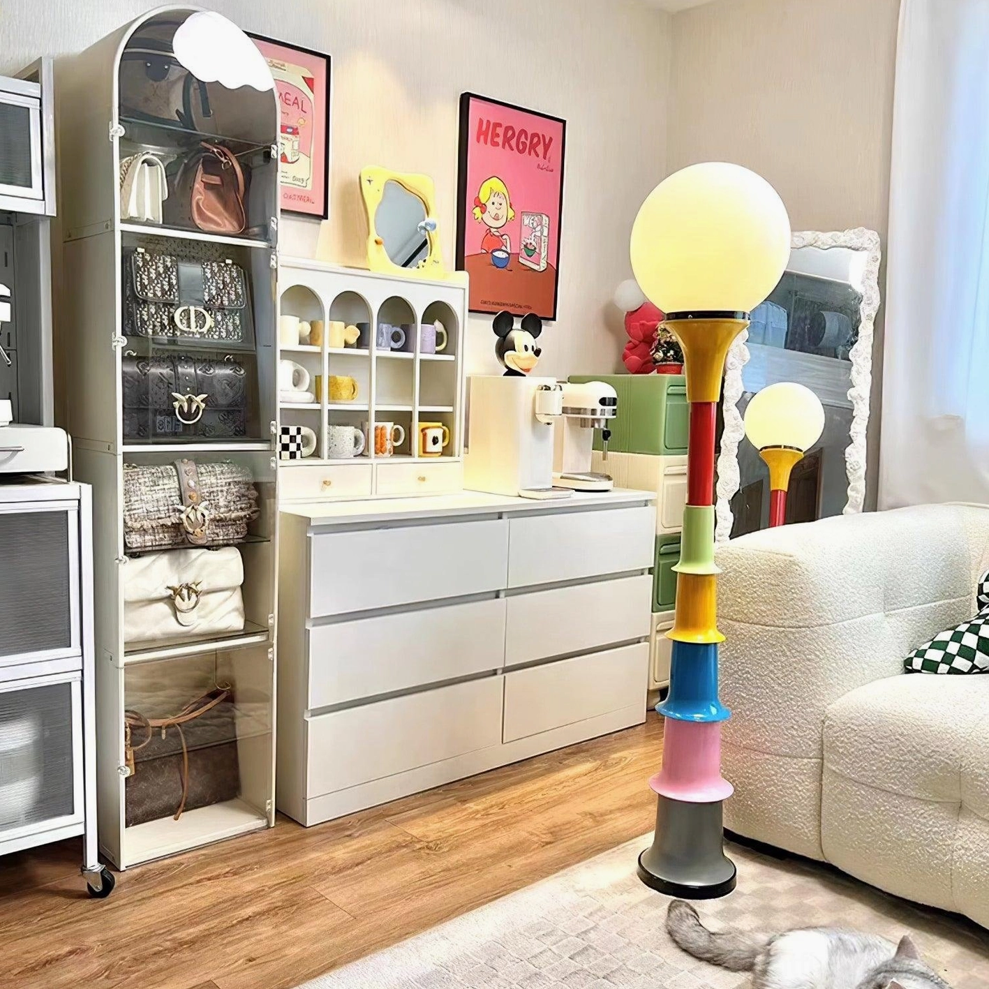 Large and mini colorful segmented floor lamps displayed in retro living room with wood flooring and storage furniture