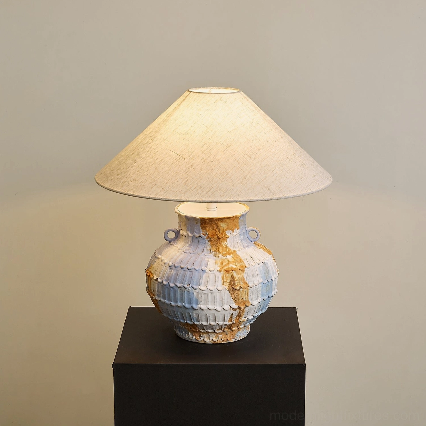 Grazie table lamp unlit displaying classic conical linen shade and textured hand-thrown ceramic base with scalloped surface details - modern ceramic table lighting