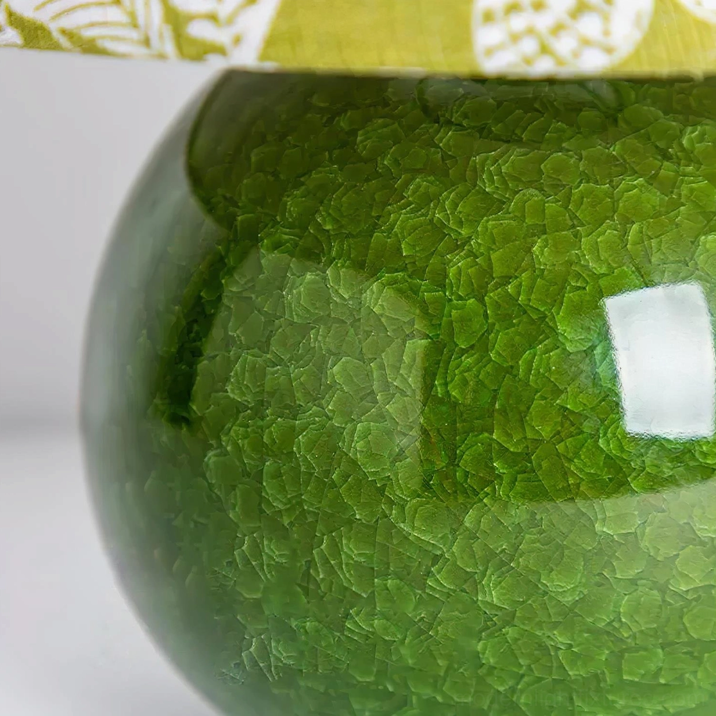 Green botanical table lamp front display showing full spherical ceramic base and printed shade