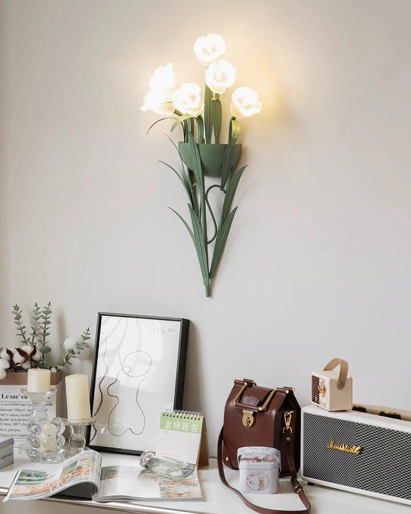 Green wall sconce with botanical artificial flowers, contemporary minimalist light fixture on wall display