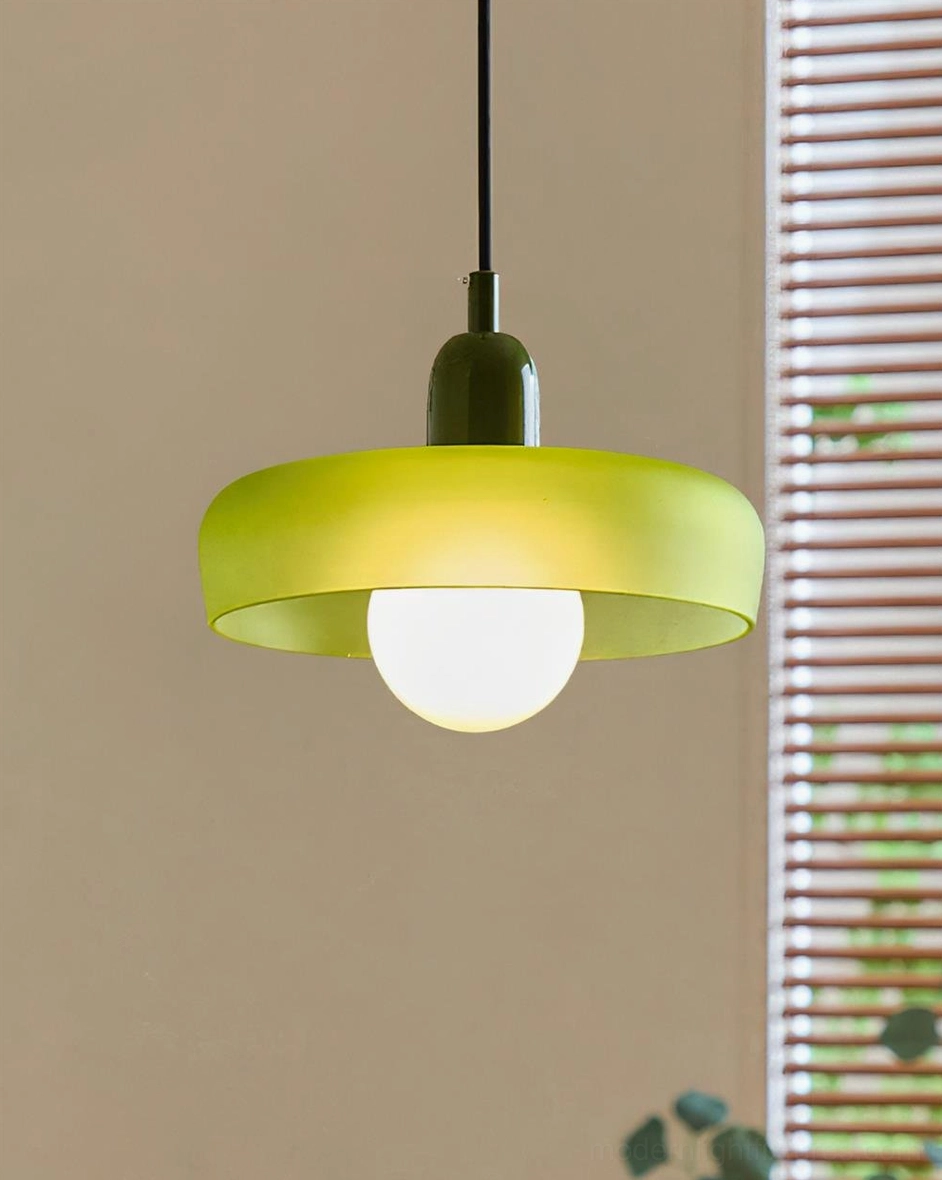 Green donut pendant light three-quarter angle with louvered window architectural background, showcasing mid-century modern pendant design