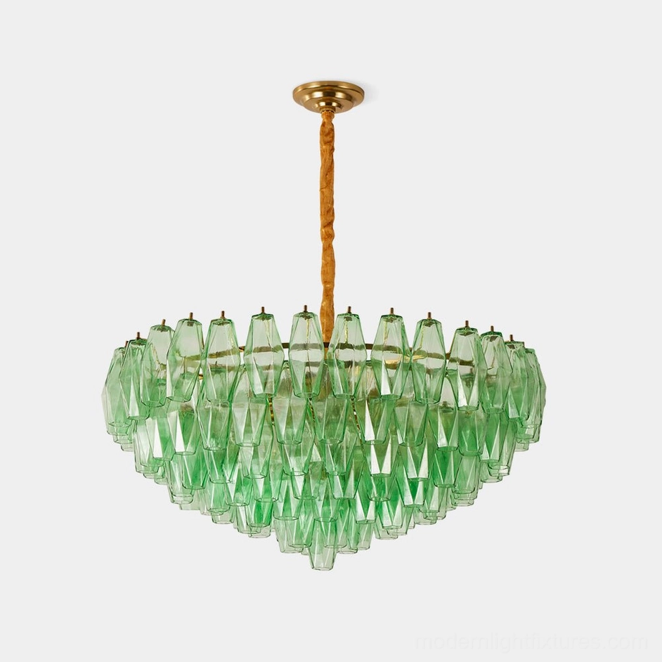 Green hand-blown glass tiered chandelier with brass gold frame and twisted suspension rod, low-angle studio view