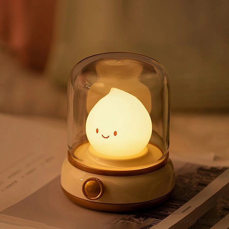 Green Flame LED night light on bookshelf desk with open books, warm 3000K glow, study environment
