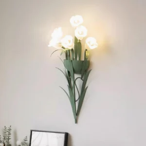 Botanical green wall sconce mounted on light gray wall with modern decor, contemporary floral wall light design
