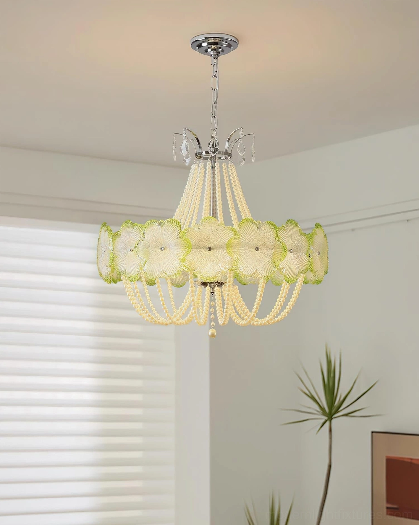 Green flower glass pendant chandelier hanging in bedroom with warm ambient lighting, contemporary interior design