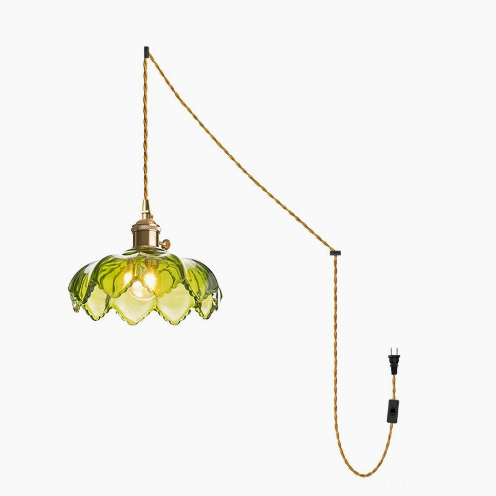 Green scalloped fluted glass shade on pendant light with twisted fabric cord overhead view studio