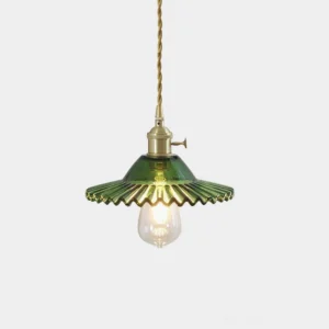 Green fluted glass pendant lamp with brass fixture and twisted fabric cord, studio frontal view showing botanical-inspired design