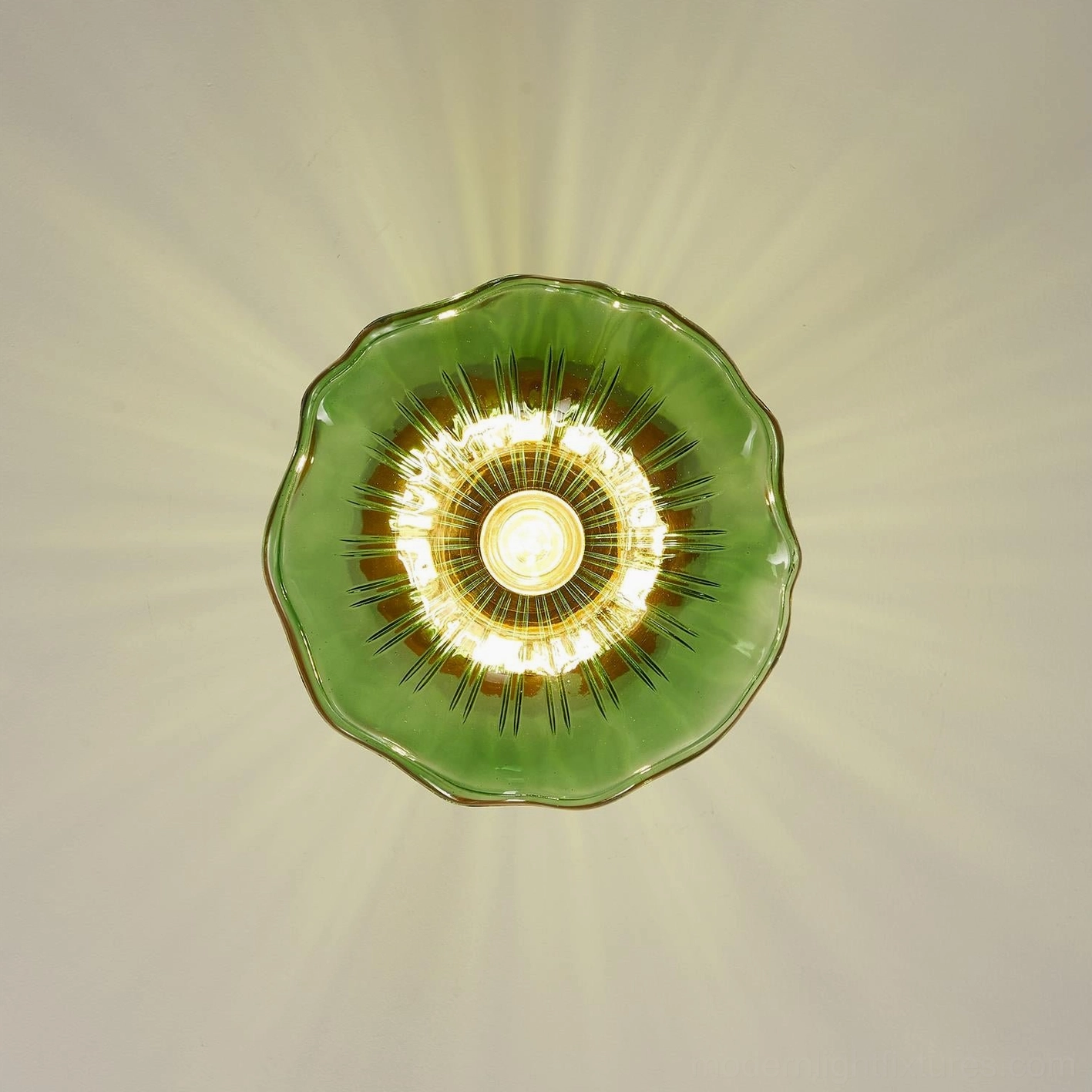 Detailed close-up of green rippled glass shade with warm light glow and wood base construction