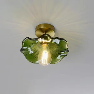 Green wavy glass ceiling light fixture mounted on residential ceiling, warm ambient lighting