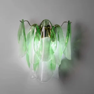 Green hand-blown glass wall sconce with layered petal design and brass hardware, unlit display