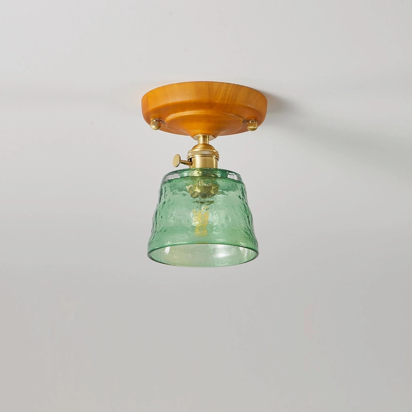 Green hand-blown glass ceiling light Model A with brass fixture studio photograph