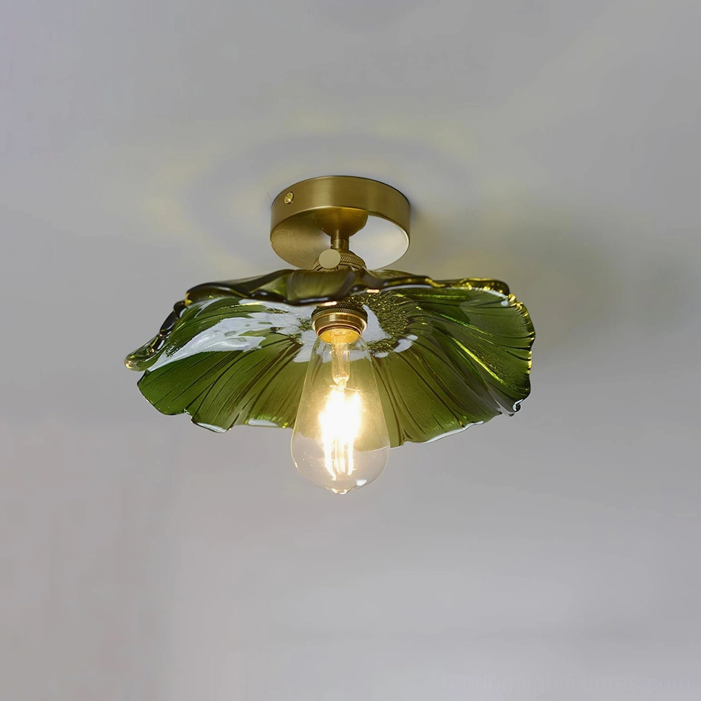 Green ruffled glass Kinney ceiling fixture in residential interior space with warm illumination