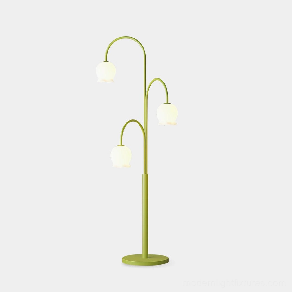 Modern green lily floor lamp with three frosted glass shades on white studio background