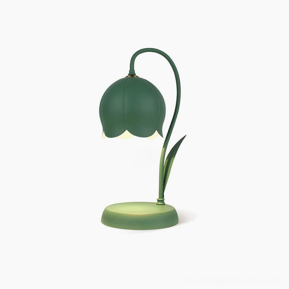 Green lily wax melting table lamp showing color finish and elegant sculptural form