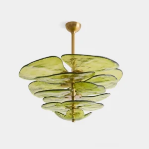 Green modern lilypad glass chandelier with layered textured glass discs in minimalist studio setting