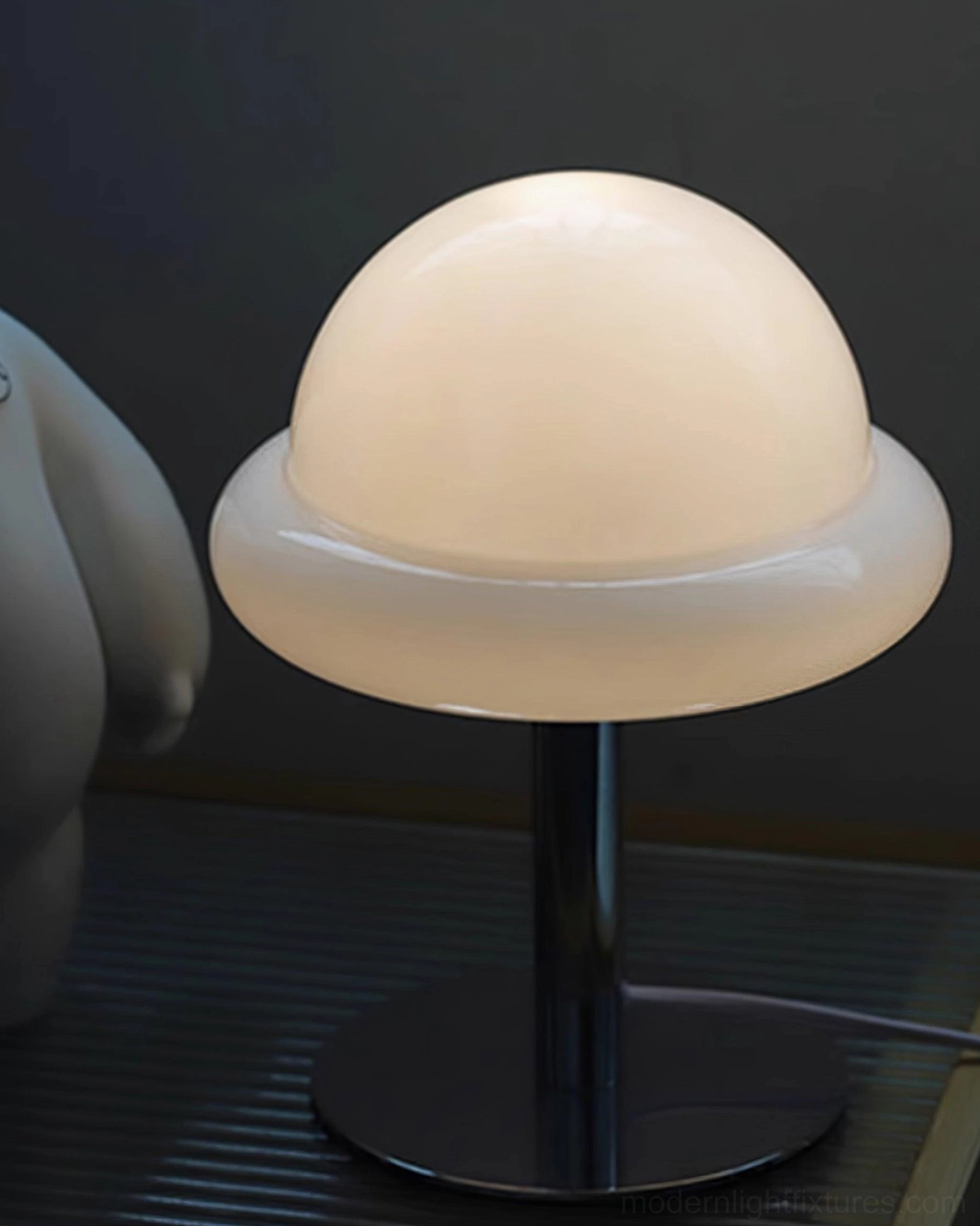 Green glass mushroom table lamp paired with home office décor on workspace desk